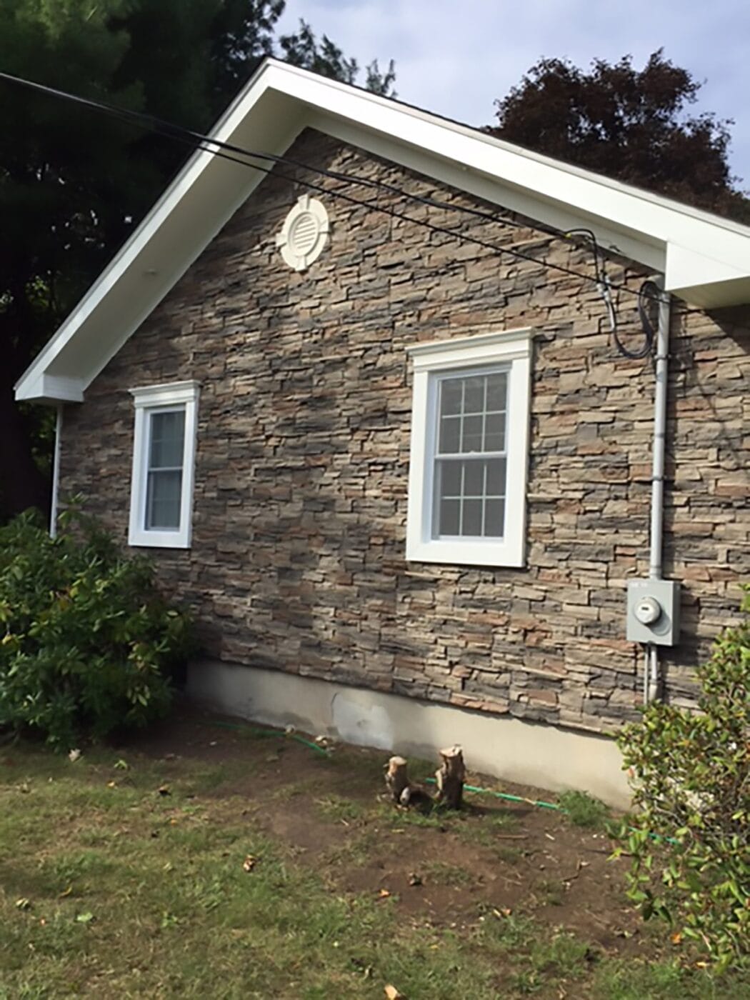 A home exterior remodel project using our Kenai Stacked Stone panels.