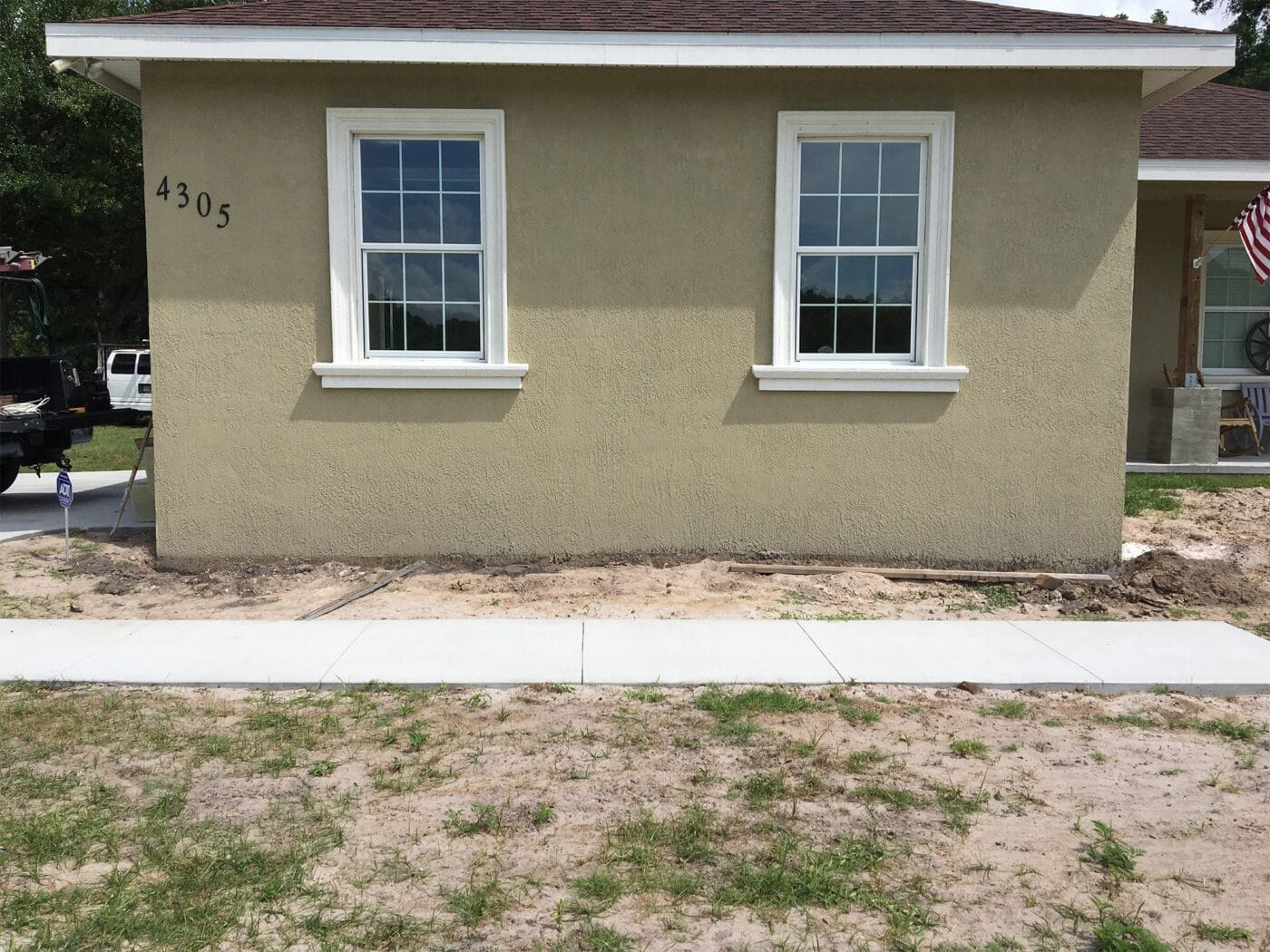 Before the completion of a front porch columns and posts project using GenStone's faux stone.