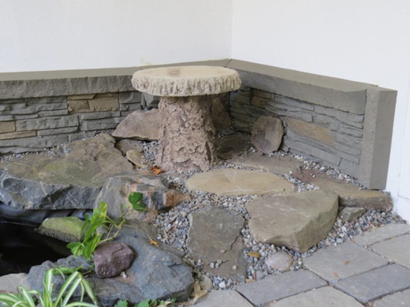 A DIY koi pond design using GenStone's Custom Color Stacked Stone panels.
