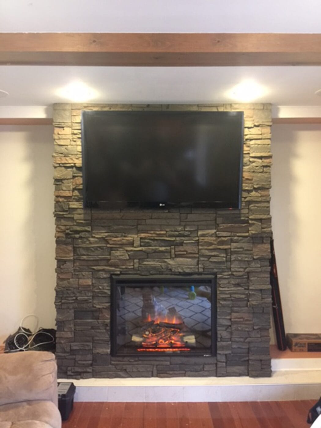 DIY fireplace surround man cave ideas using our Stratford Stacked Stone panels.