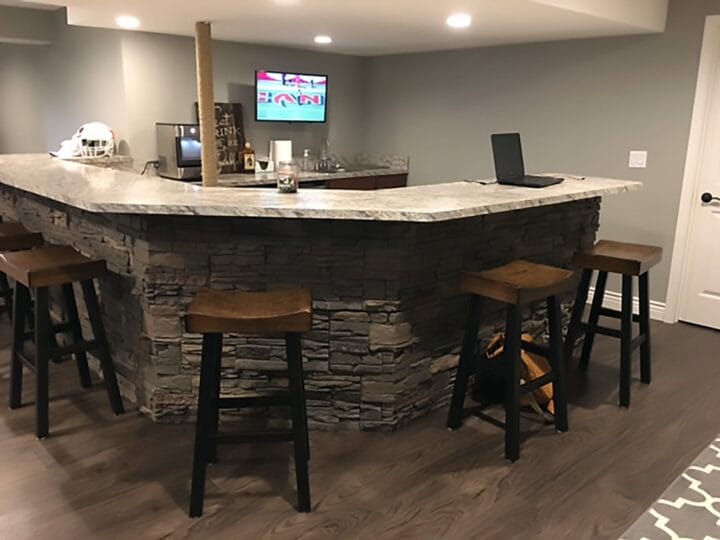 A DIY home bar design using our Stratford Stacked Stone panels.