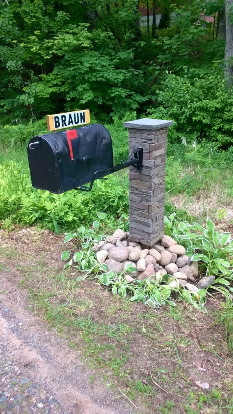 A DIY stone column mailbox using GenStone's Custom Stacked Stone panels.