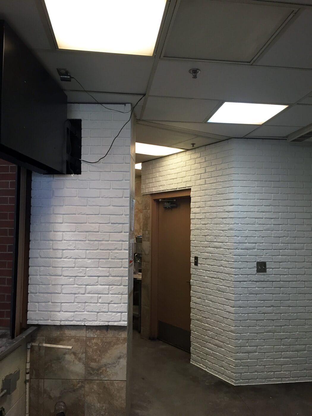 A concrete wall paneling project using our Custom Color Brick Veneer.