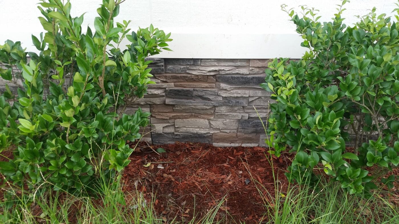 A DIY home skirting project using Kenai faux stone.