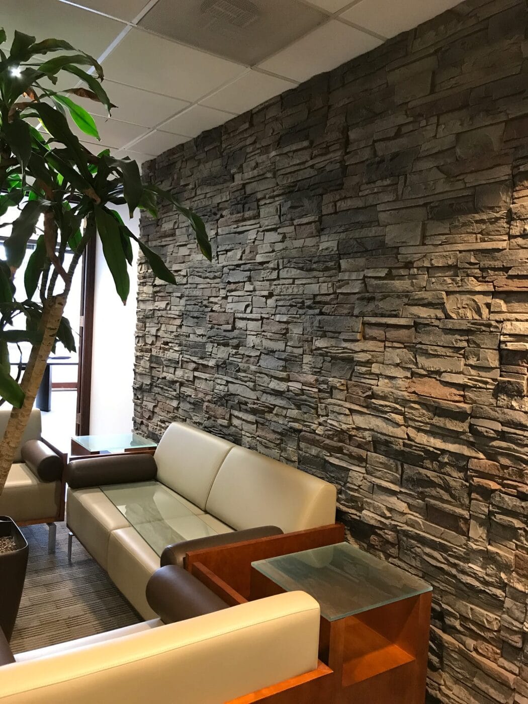 An office accent wall using Kenai Stacked Stone panels for DIY project ideas.