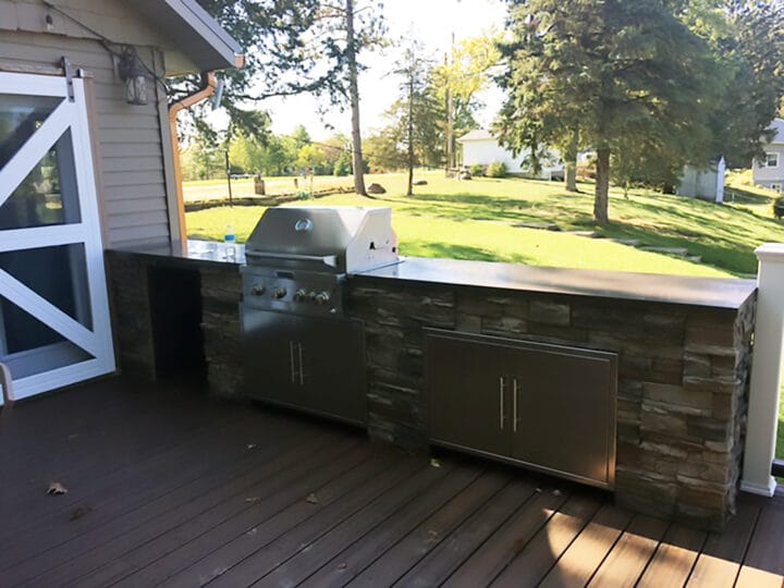 A DIY BBQ grill area designed using our Kenai Stacked Stone panels.