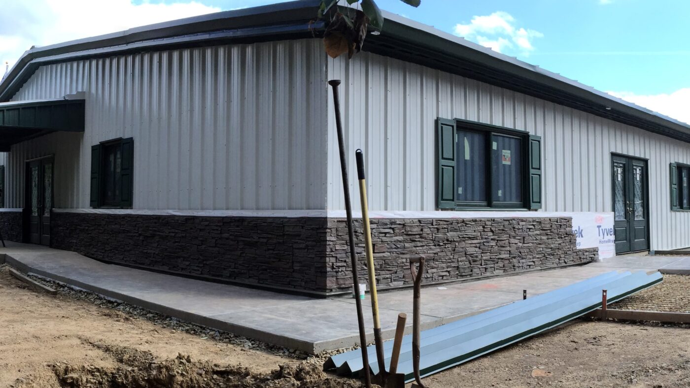 A steel building wainscot using Coffee Stacked Stone.