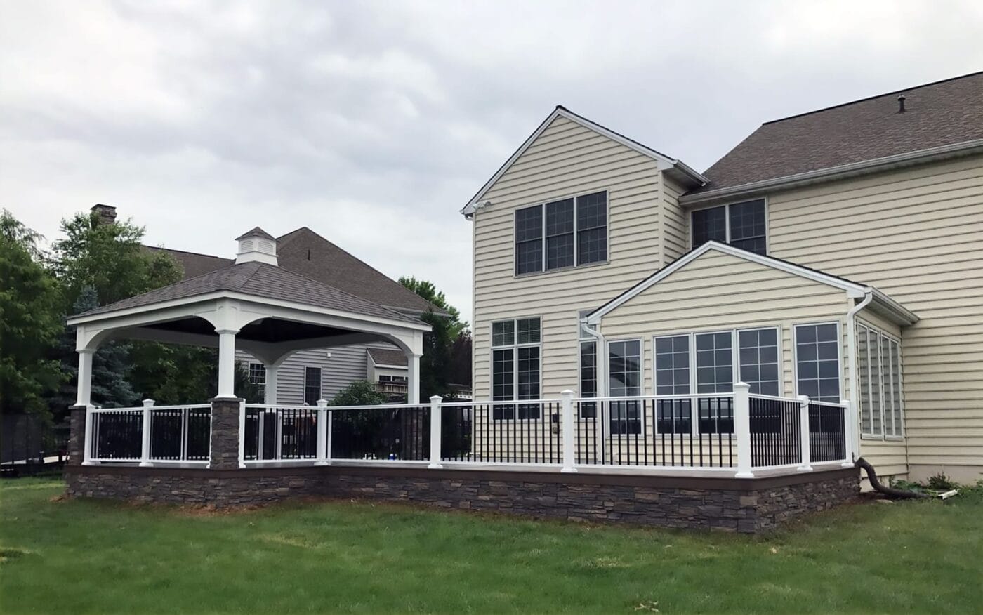 A porch skirting and column wraps project using GenStone's Stratford Stacked Stone panels.