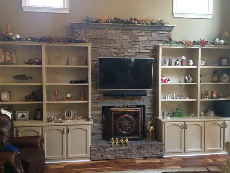 A TV accent wall and faux fireplace idea made using our Desert Sunrise Stacked Stone panels.