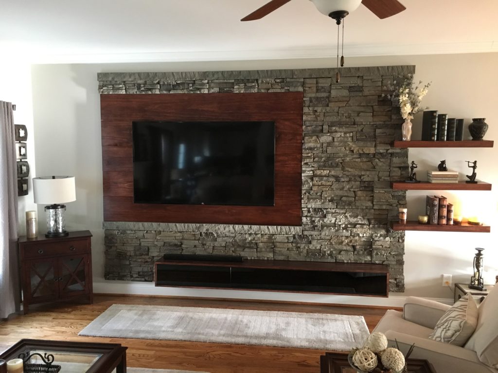A living room interior accent wall project completed with Kenai Stacked Stone panels.