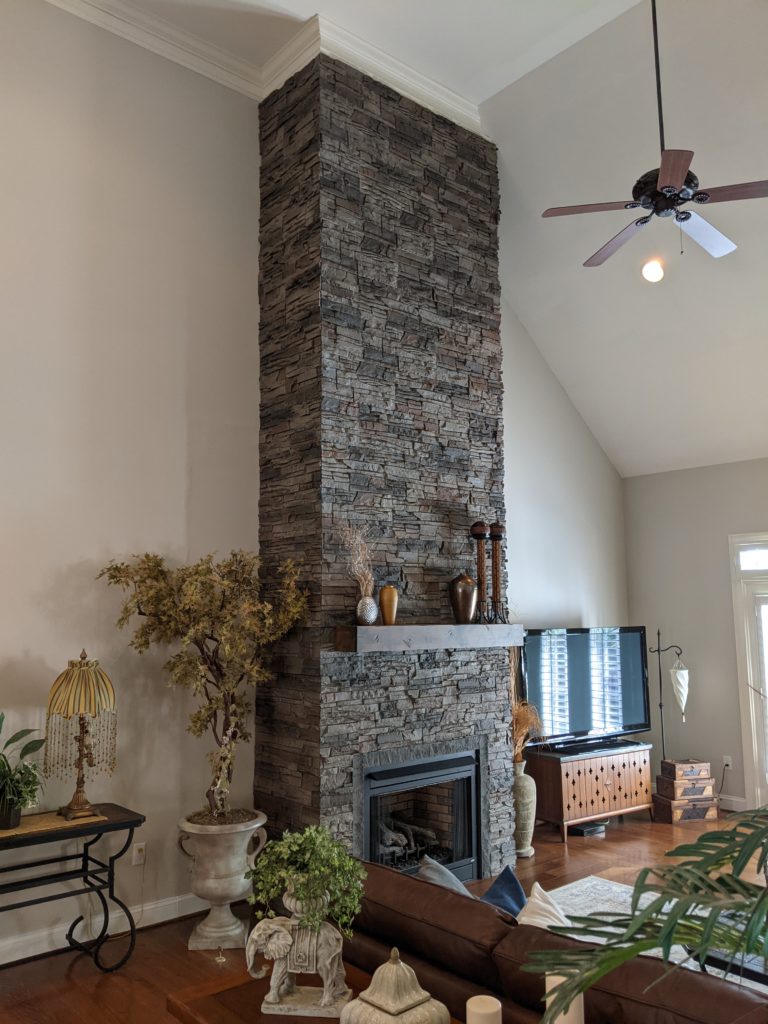 Kenai Stacked Stone on a floor to ceiling living room fireplace
