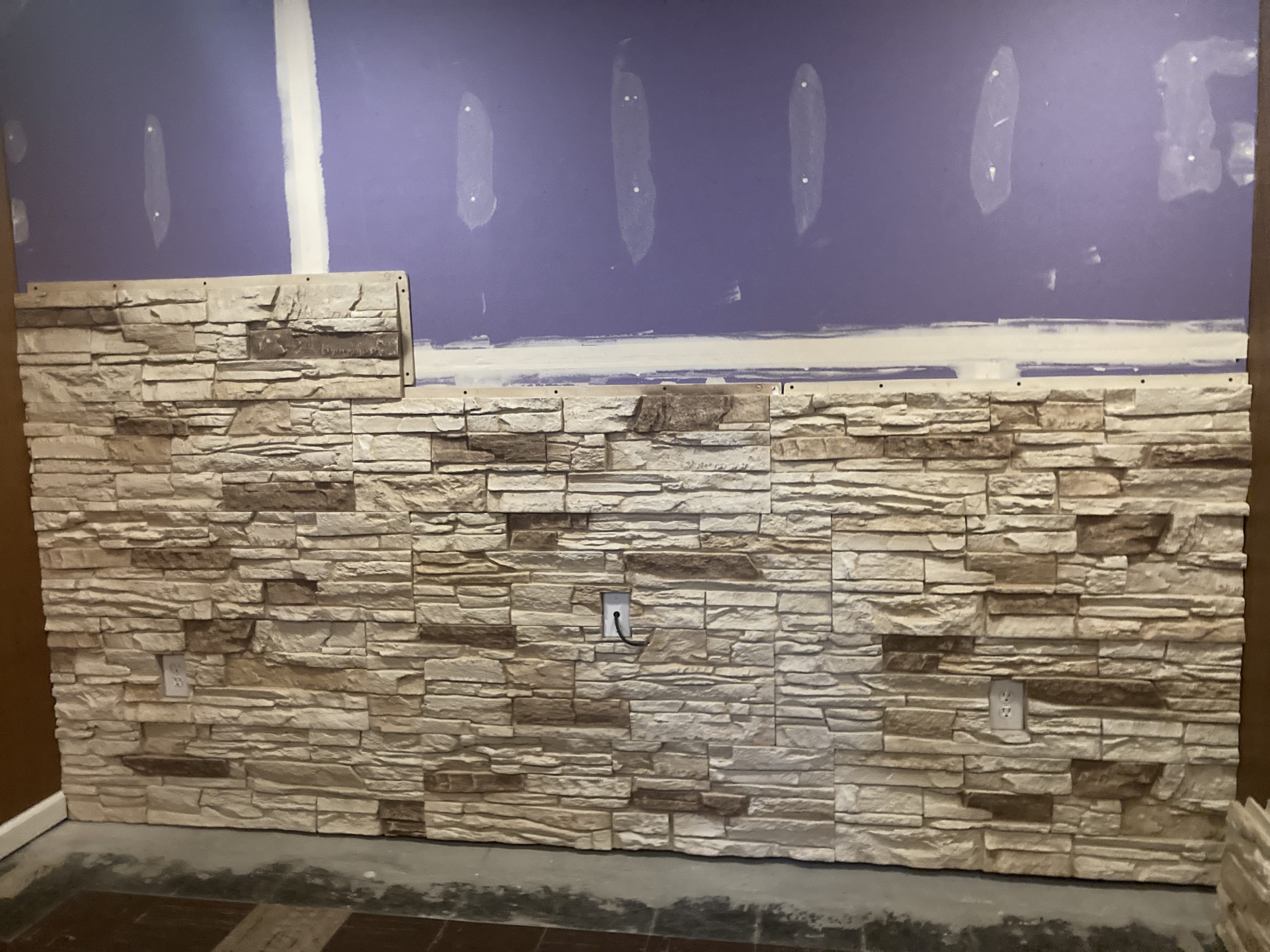 Before man cave fireplace wall