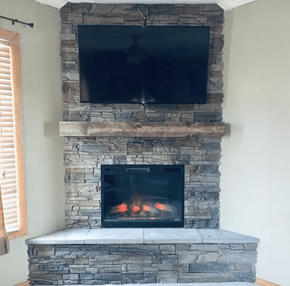 Kenai faux stone corner fireplace
