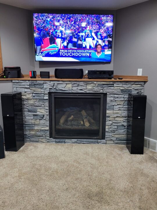 Corner Fireplace Design Ideas with Faux Stone by Corey