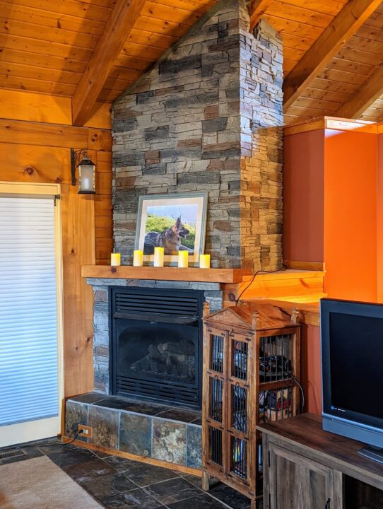 Kenai stone veneer corner fireplace