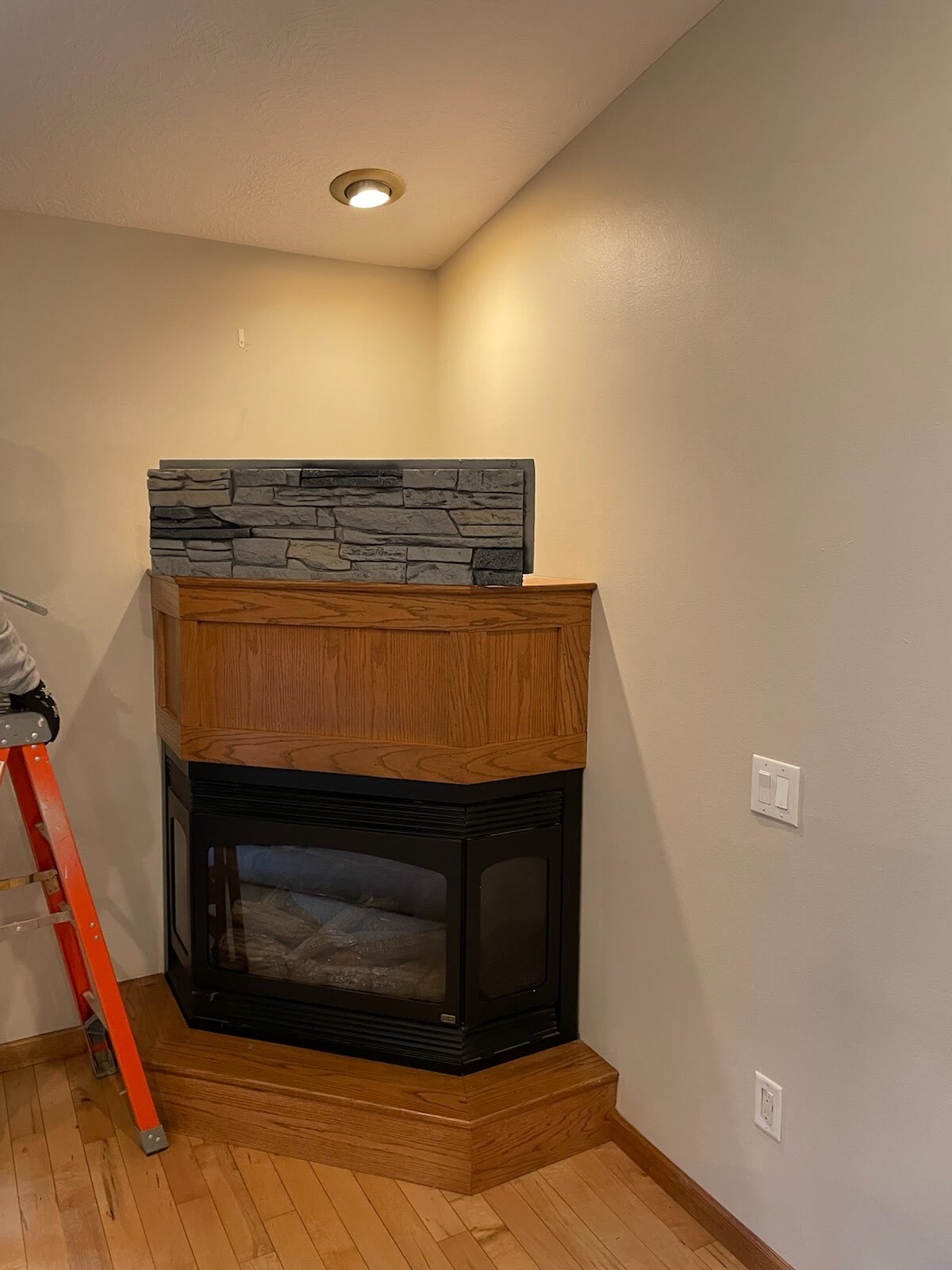 Before electric fireplace TV wall