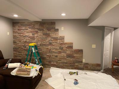 During Installation of faux stone basement accent wall