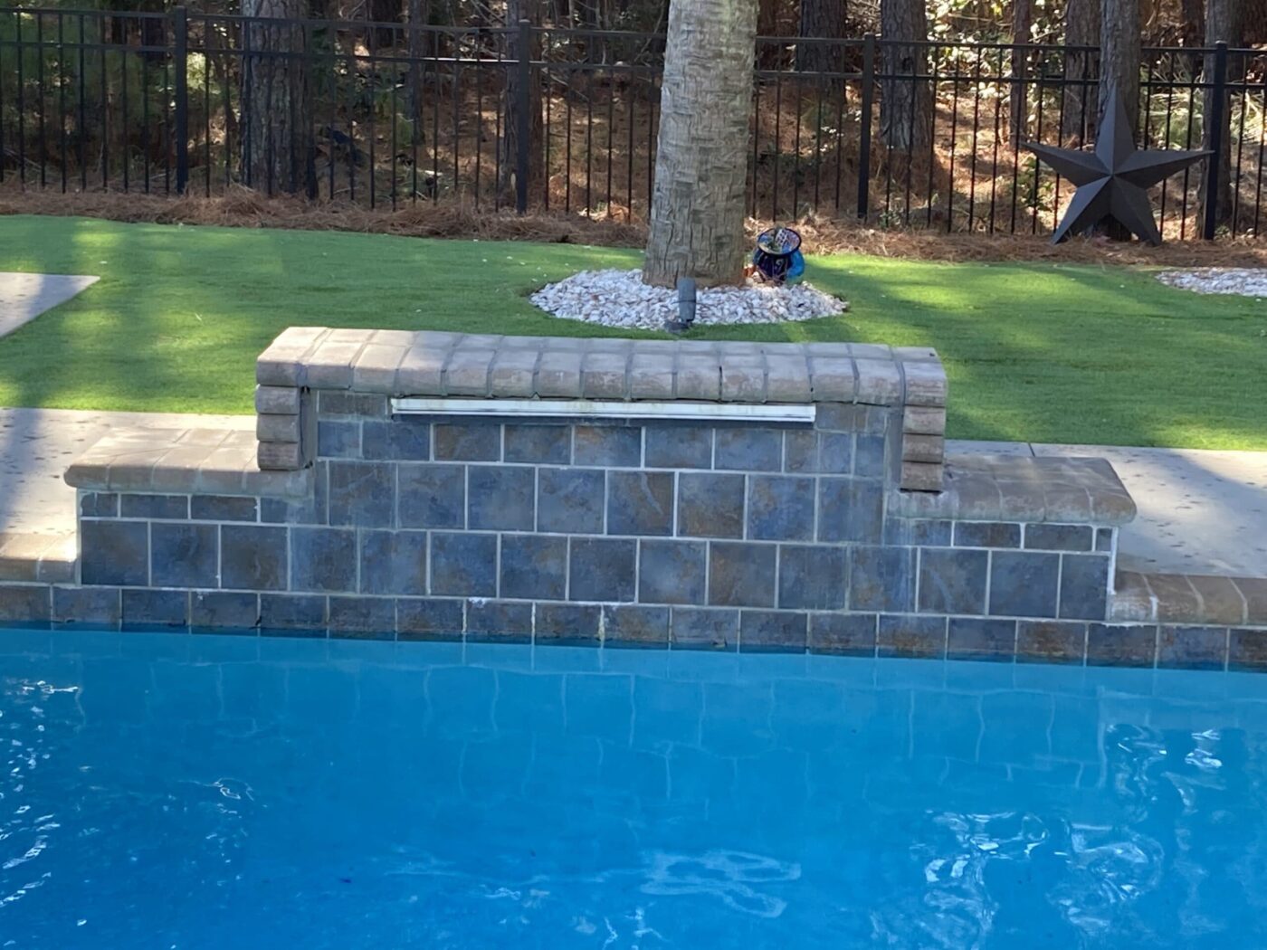 Before Vanilla Bean stone veneer pool fountain