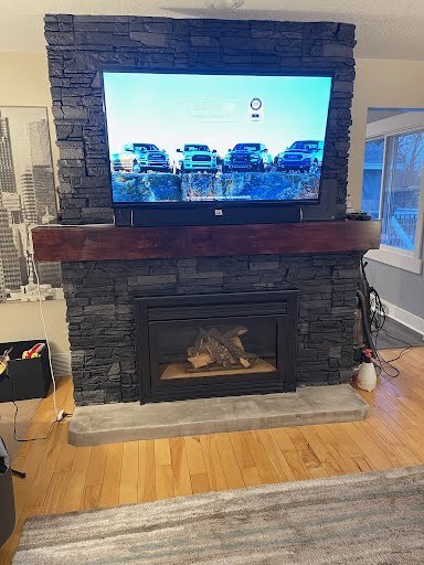 Iron Ore faux stone electric fireplace and TV wall