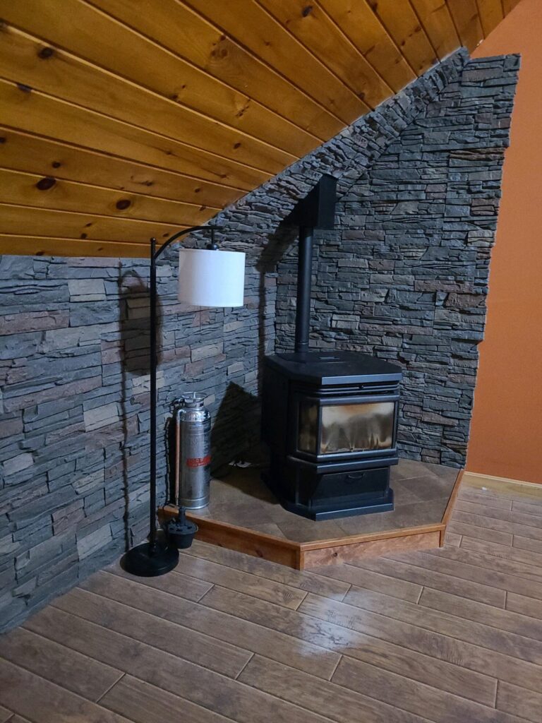 After Stratford faux stone wood stove surround