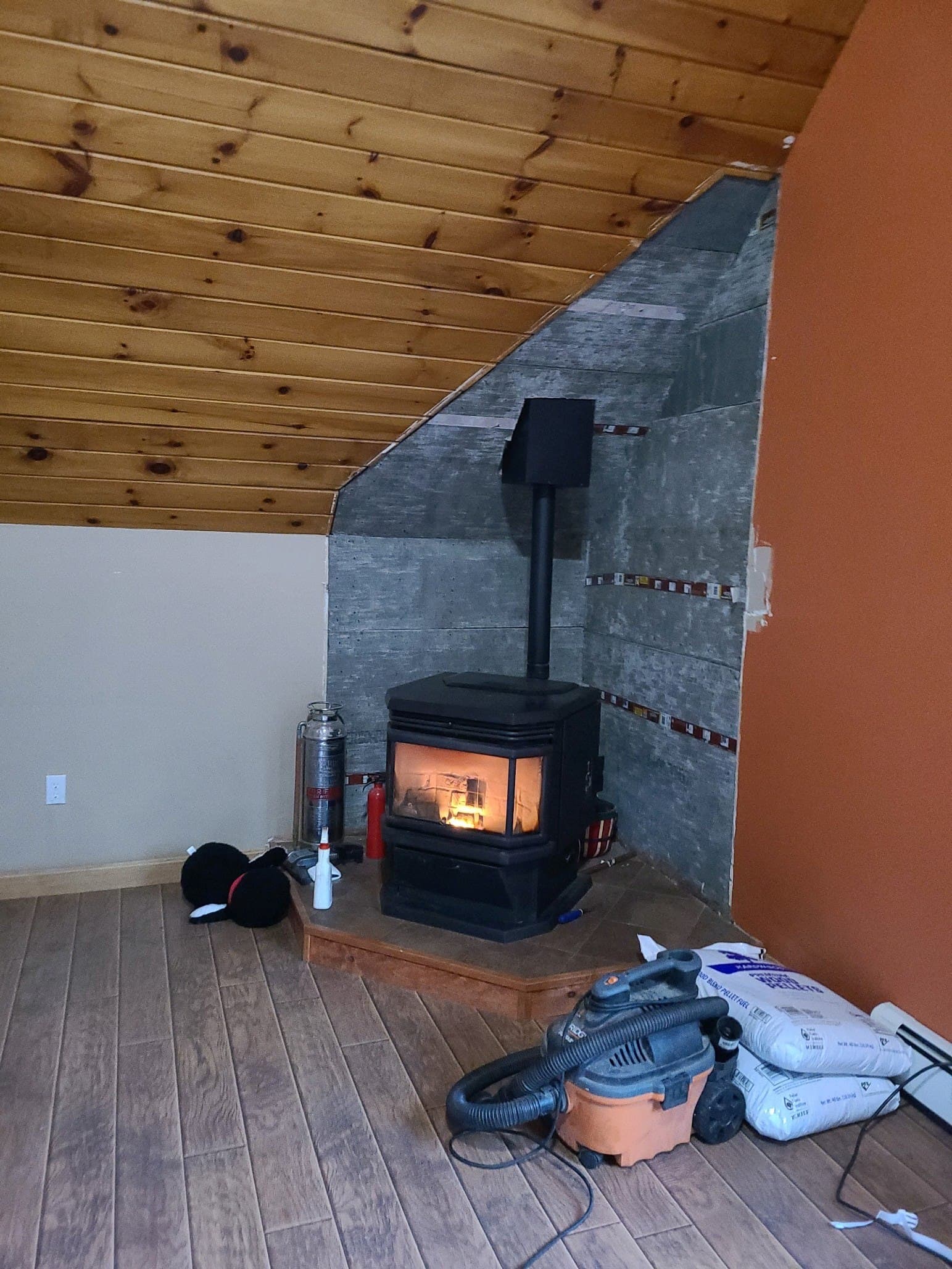 Before faux stone wood stove surround