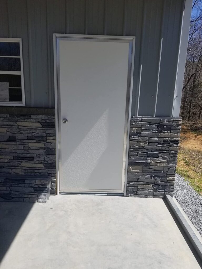 Northern Slate faux stone wainscoting on metal building