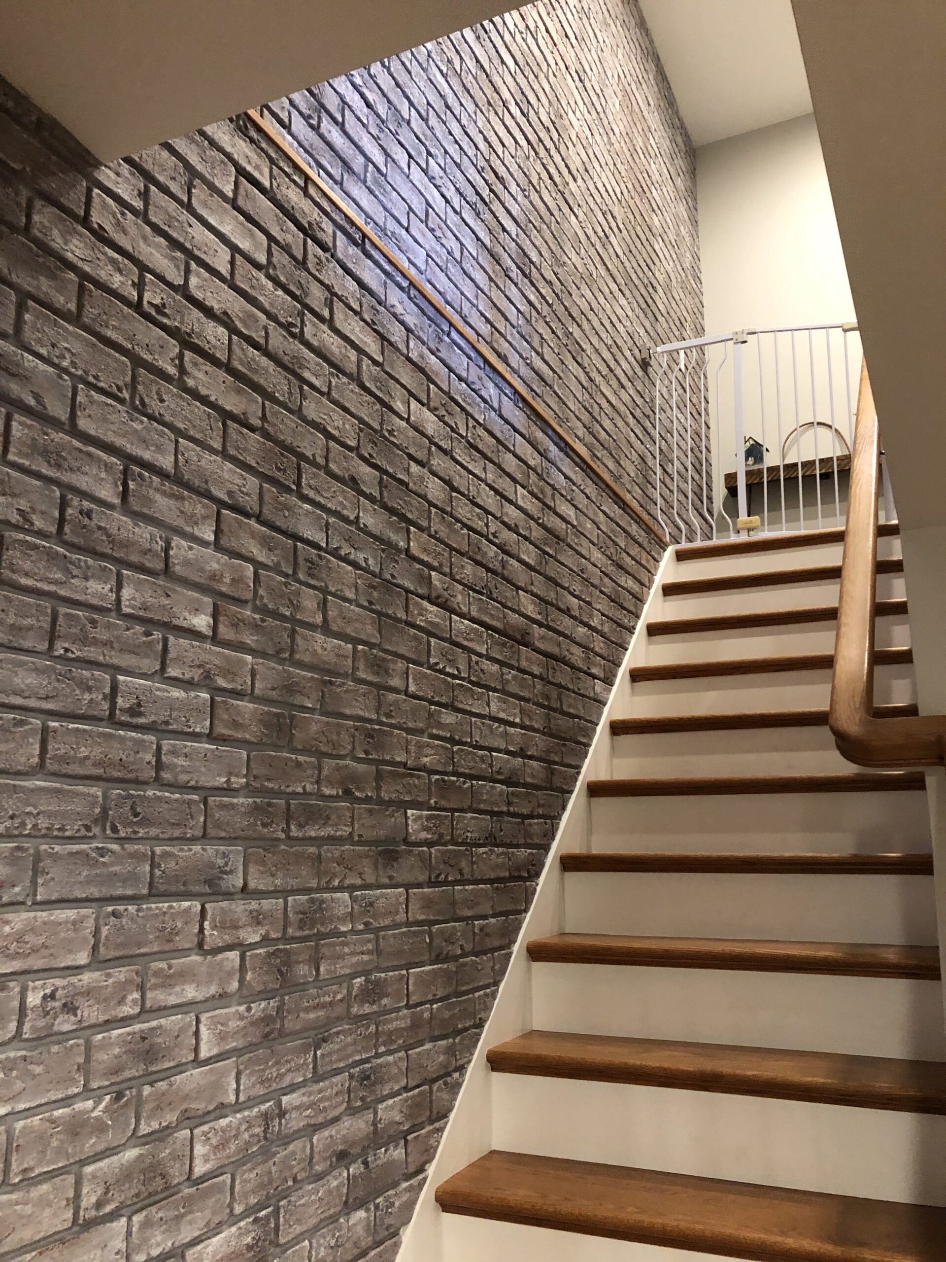 brick veneer staircase accent wall