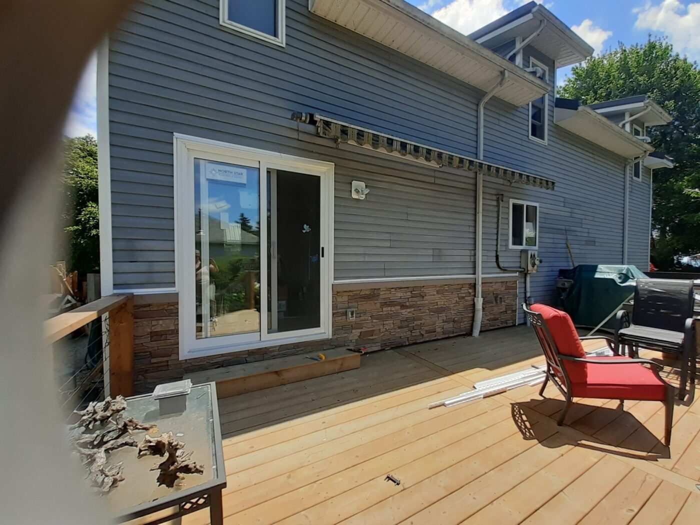 After Desert Sunrise faux stone deck wainscoting