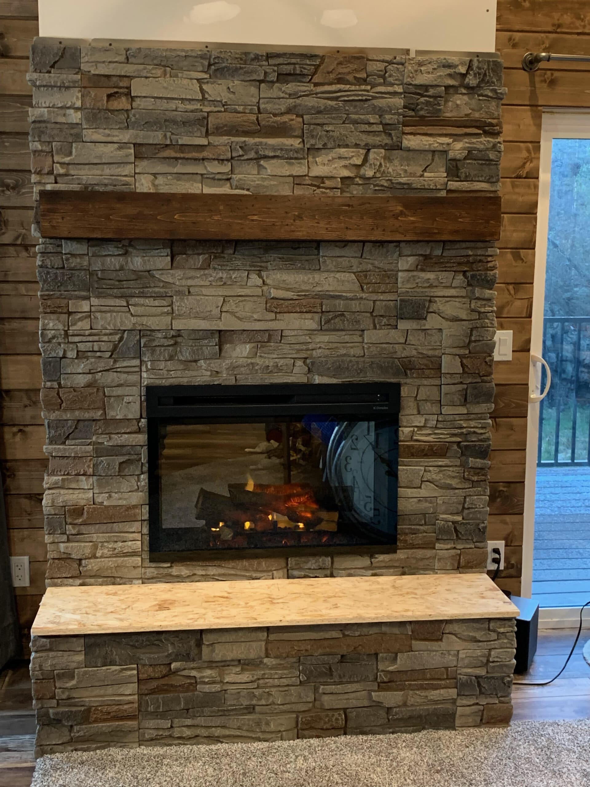 Kenai Stacked Stone cozy fireplace interior design