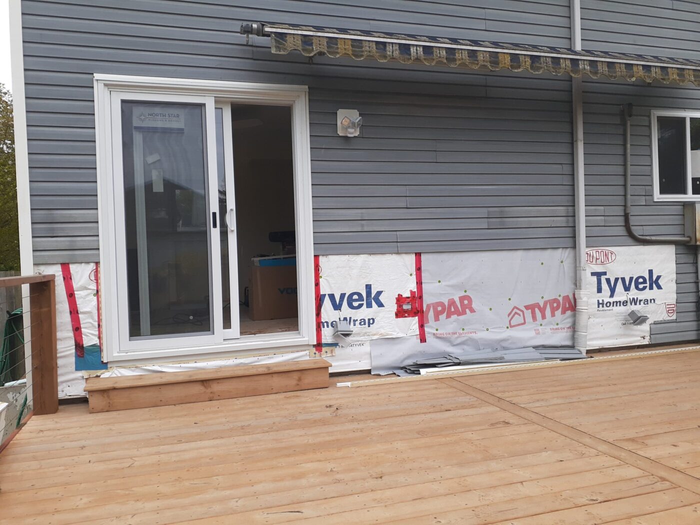 Before faux stone deck wainscoting