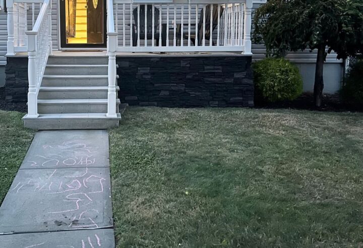 A DIY front porch wainscoting project using our Iron Ore faux stone panels.