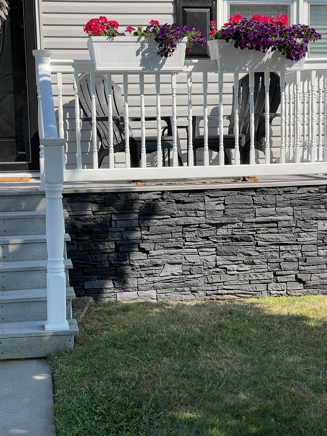 A DIY front porch wainscoting project using our Iron Ore faux stone panels.