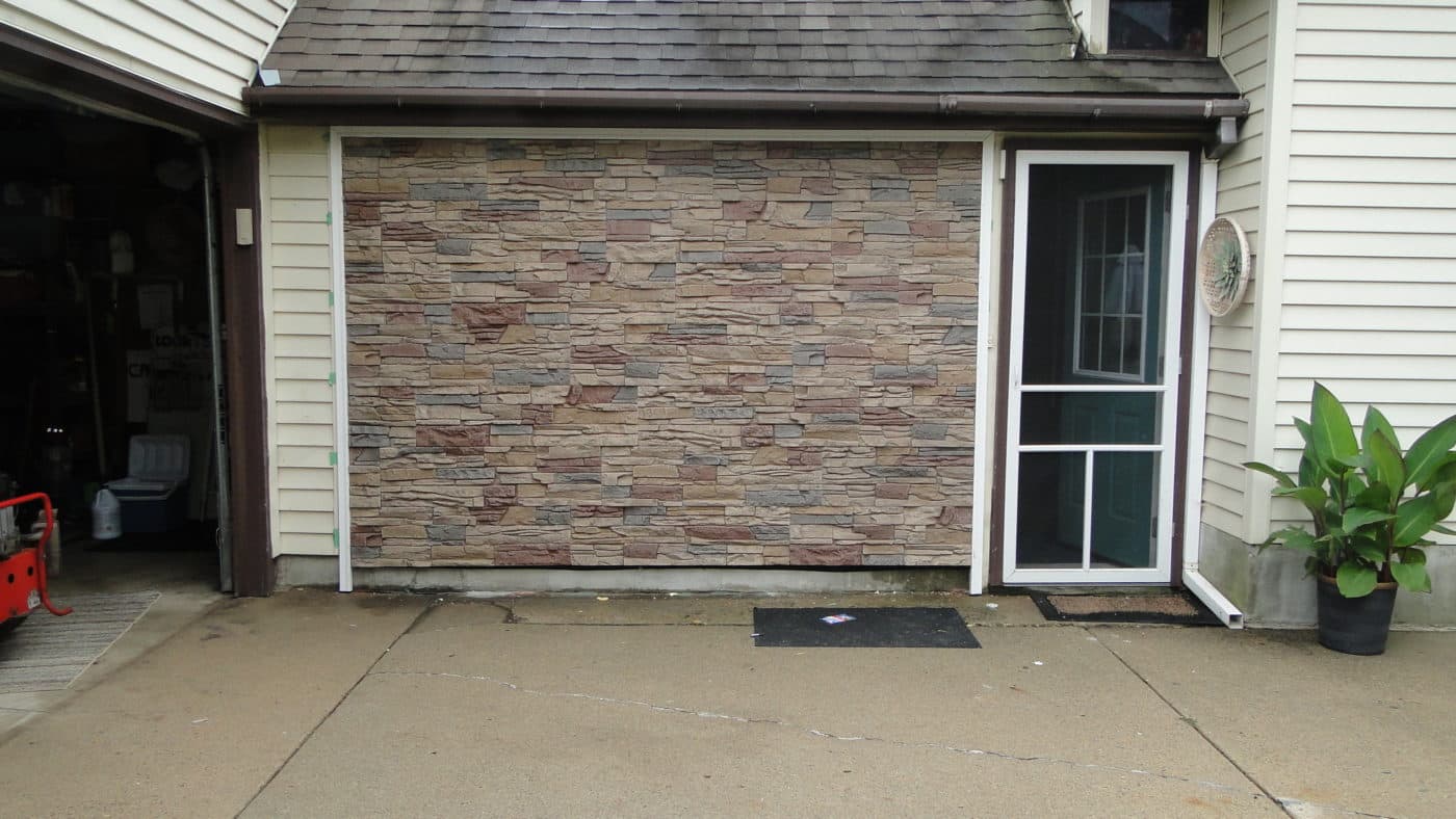 After DIY Desert Sunrise Faux Stone Exterior Accent Wall
