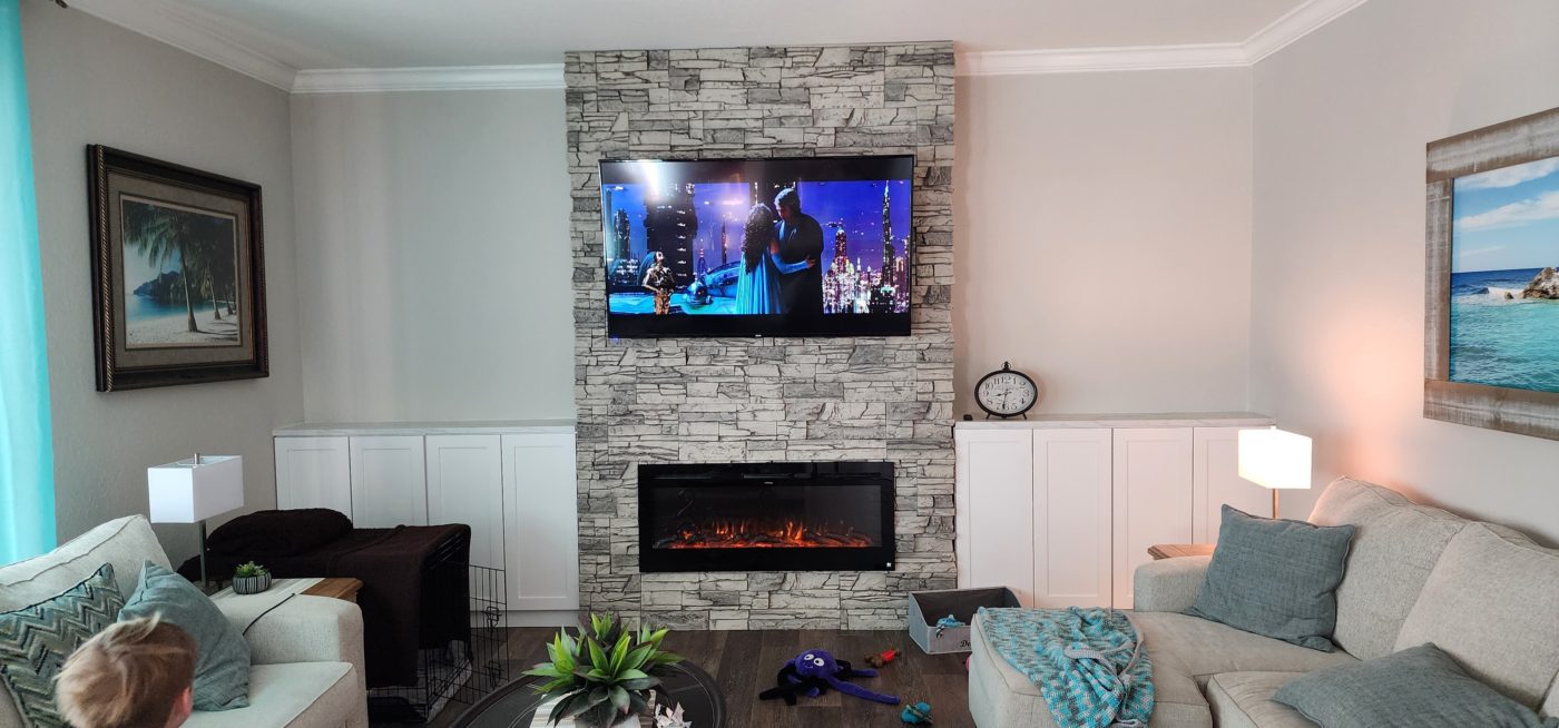 After Arctic Smoke Stacked Stone TV Over Linear Fireplace Design