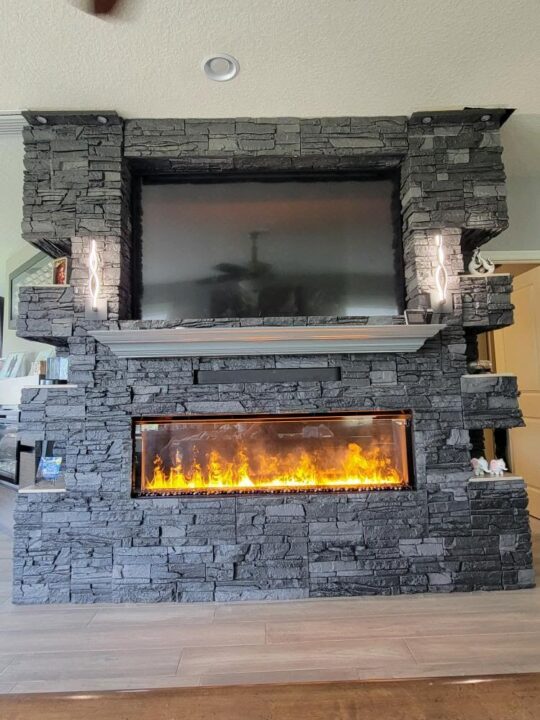 Iron Ore Stacked Stone Electric Fireplace Surround TV Wall