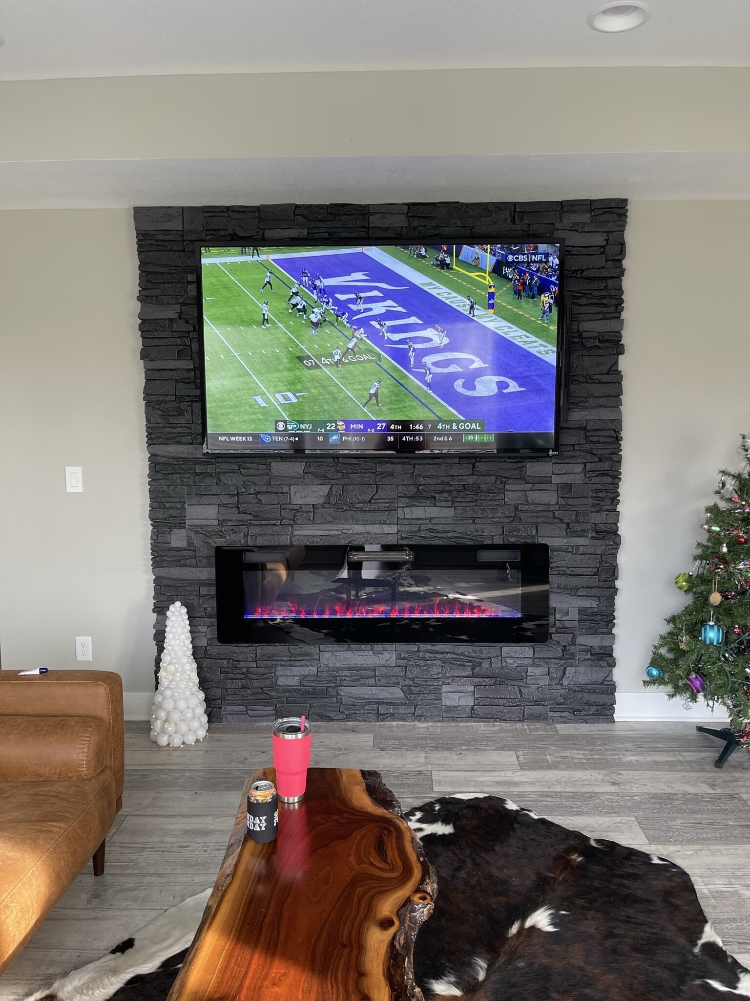 Iron Ore Stacked Stone Electric Fireplace and TV Surround