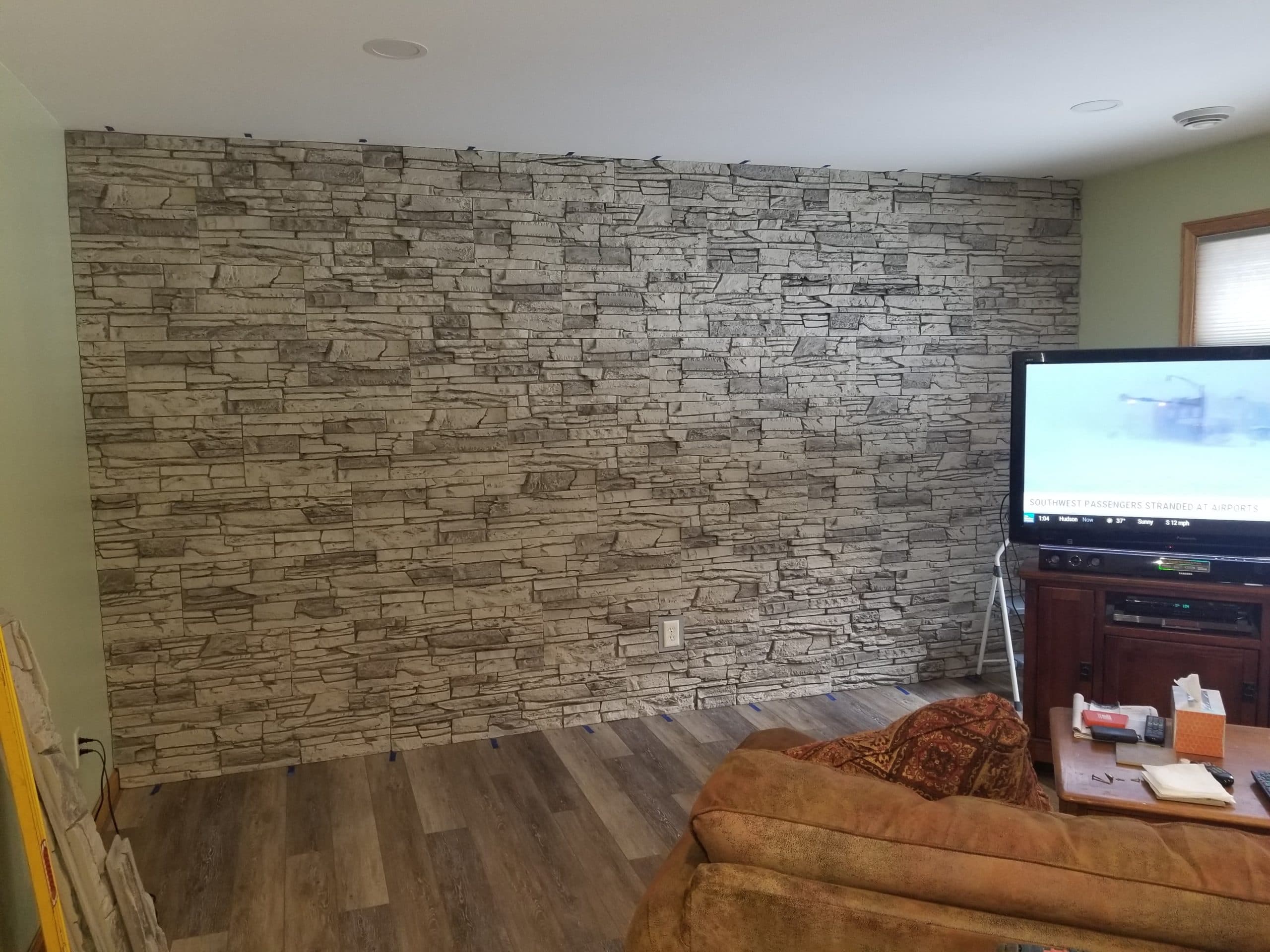 A living room accent wall made with Arctic Smoke Stacked Stone