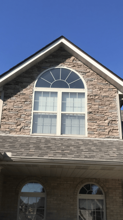 Second story siding with Desert Sunrise faux stone.