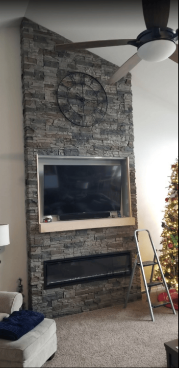 A faux stone linear fireplace design using Kenai Stacked Stone panels.