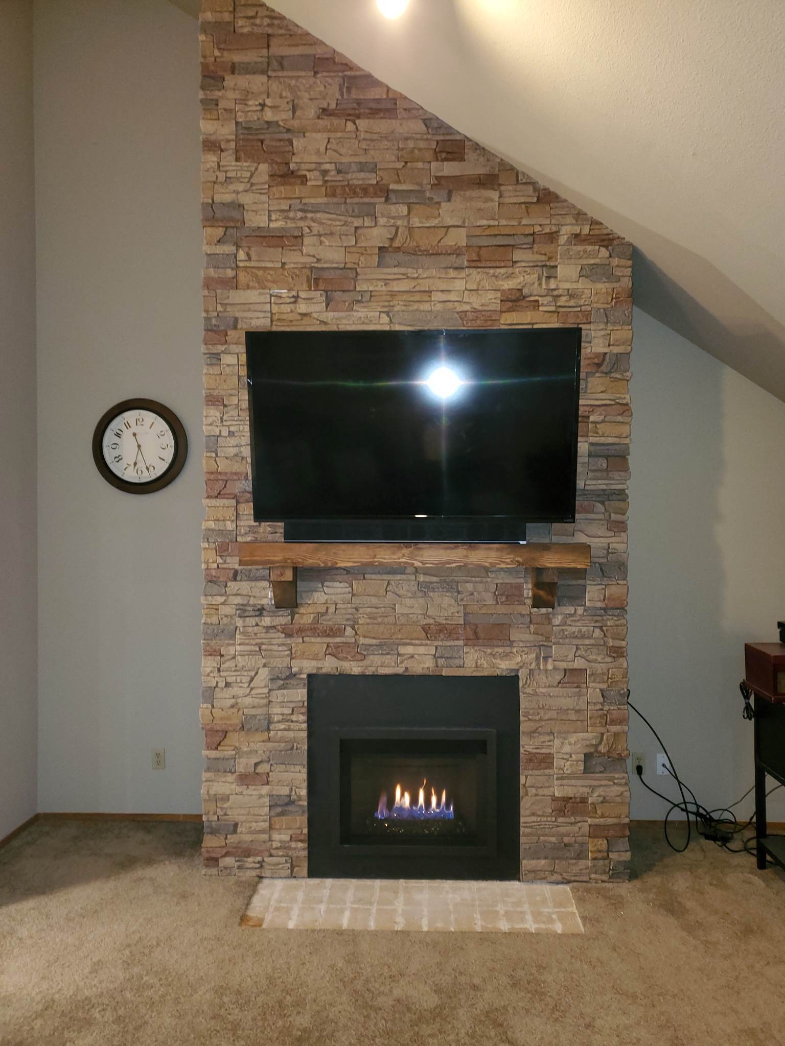 A DIY electric fireplace project using Desert Sunrise Stacked Stone.
