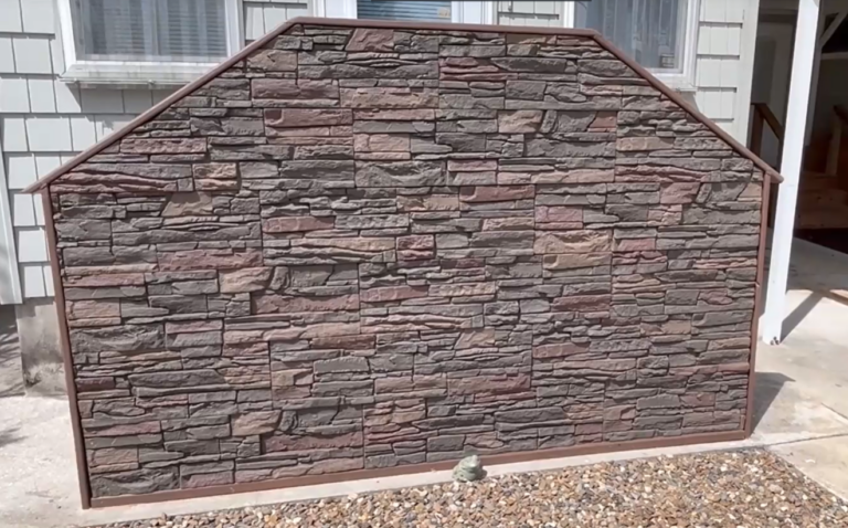 An accent wall on an exterior stairwell made of Coffee Stacked Stone panels.