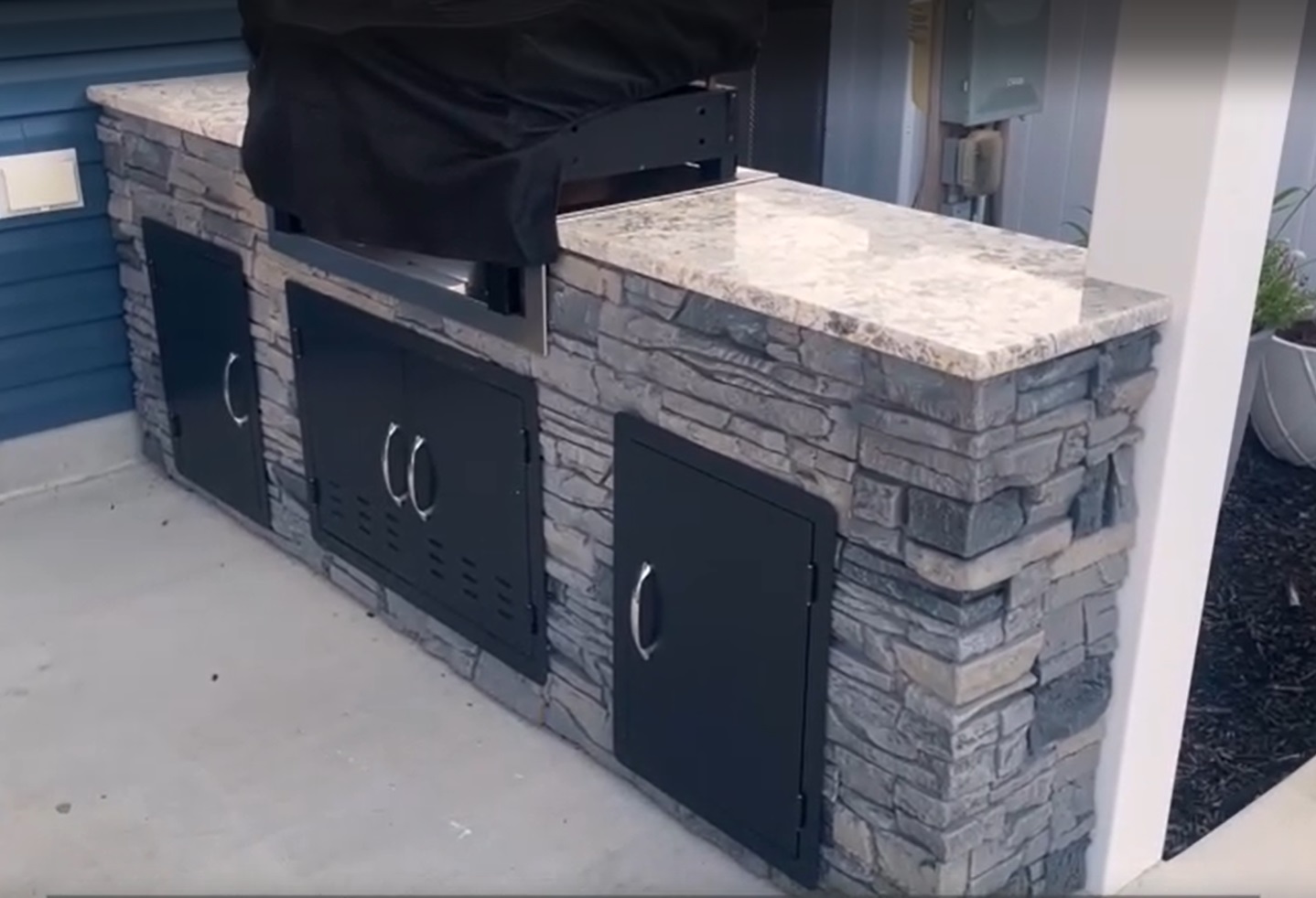 A Faux Stone Grill Idea using Northern Slate Stacked Stone panels.