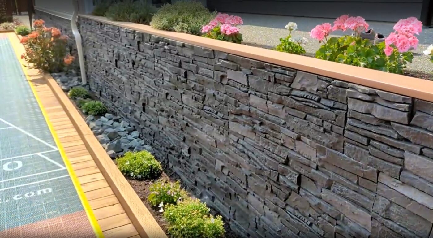 A Wainscot & Retaining Wall project using Iron Ore Stacked Stone panels.