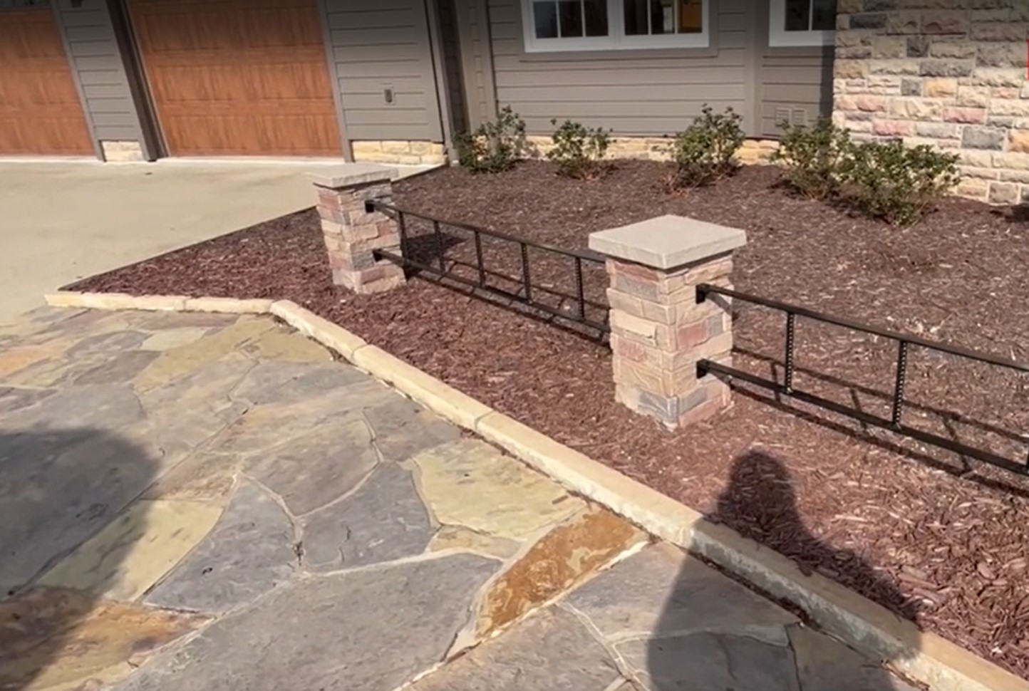 A front yard project using our Desert Sunrise faux stone pillars.