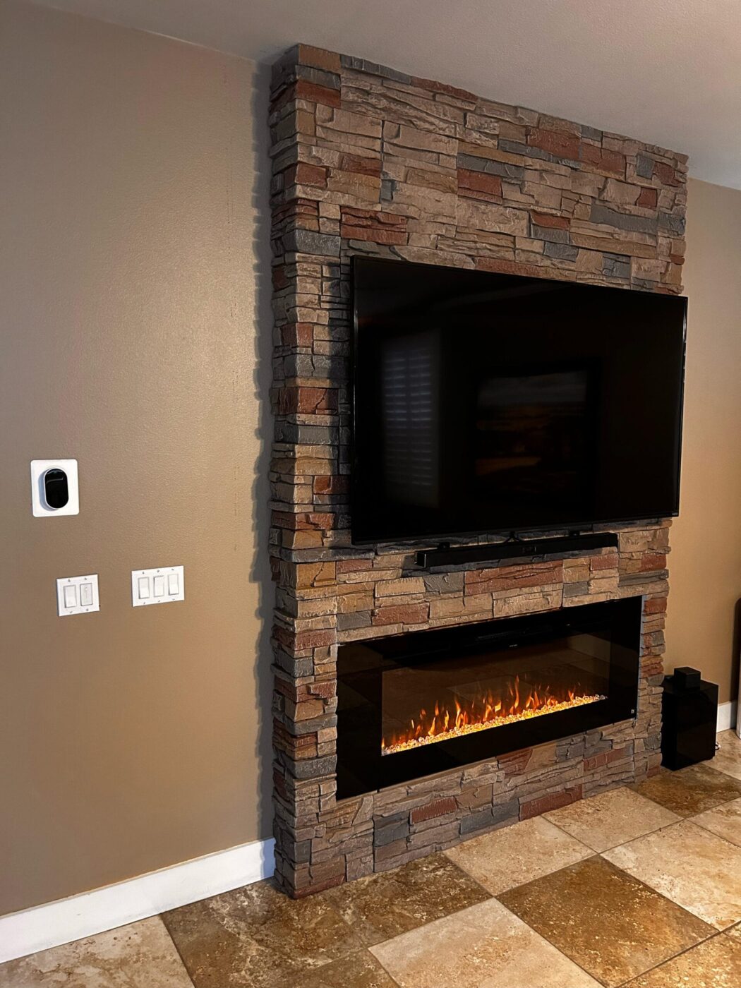 A DIY linear fireplace surround project using GenStone's Desert Sunrise faux stone panels.