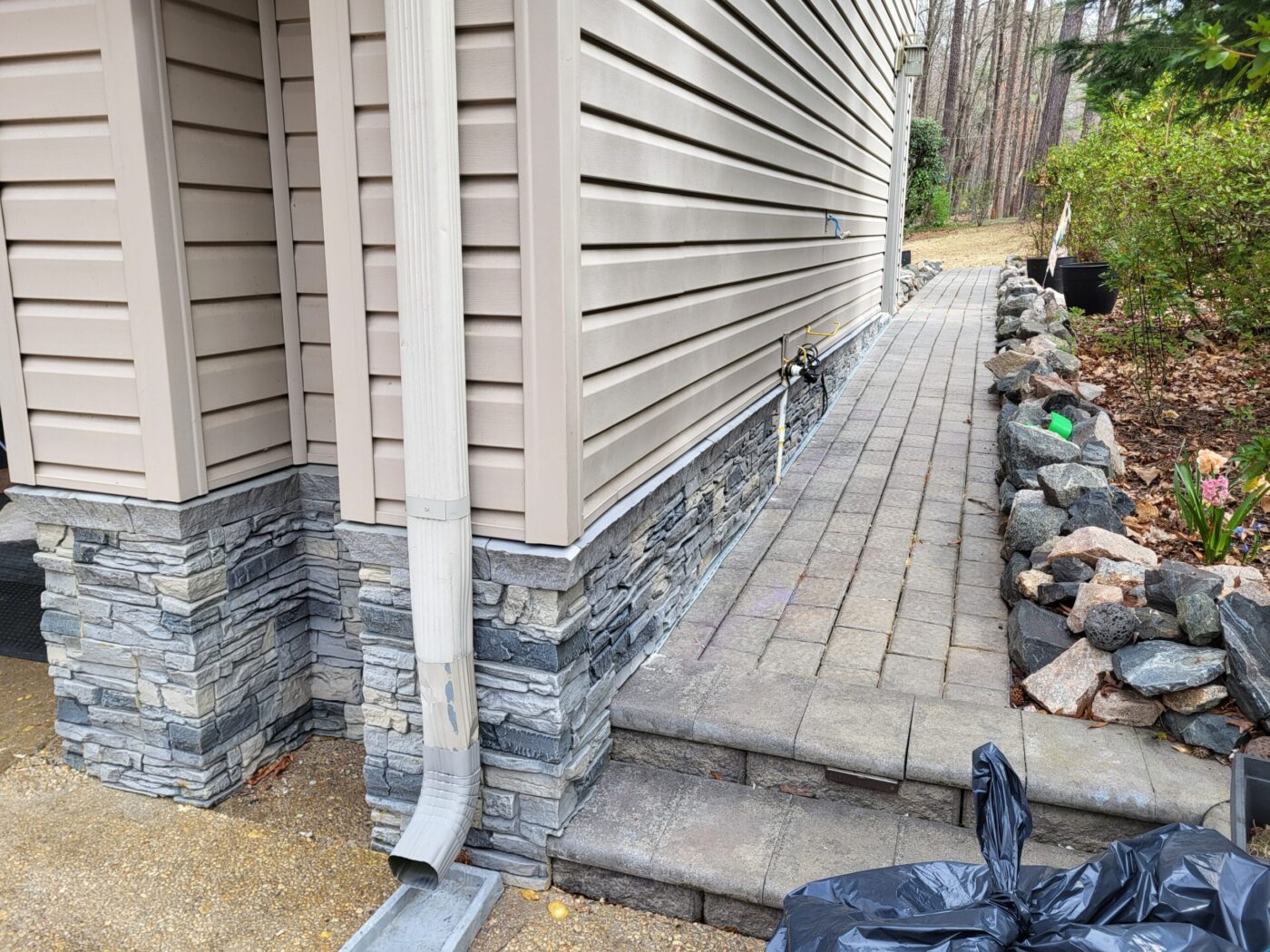 A DIY foundation cover up project idea using GenStone's Northern Slate Stacked Stone panels.