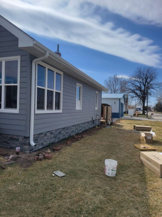 A DIY foundation cover up project using GenStone's Northern Slate faux stone panels.