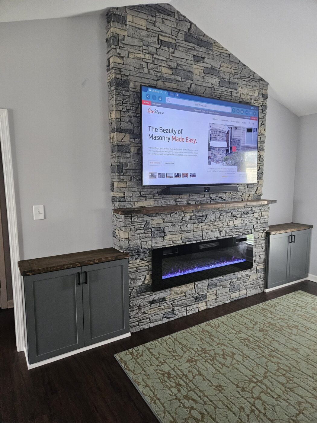 An asymmetrical fireplace surround using GenStone's Northern Slate Faux Stone panels.