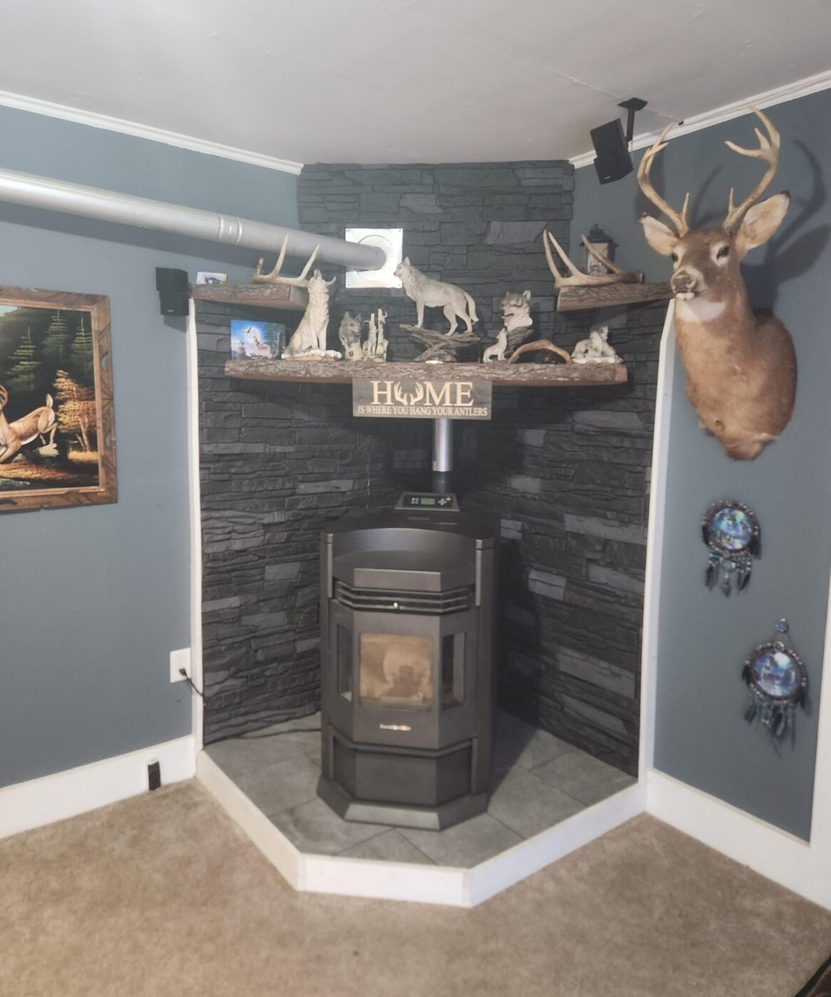 A DIY wood stove surround using GenStone's Iron Ore Stone Veneer panels.