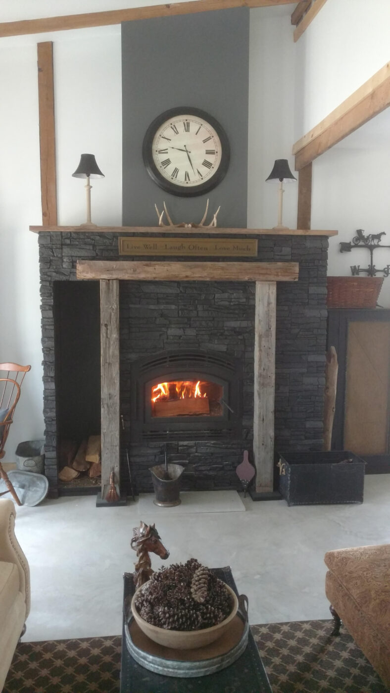 A fireplace surround remodel project that uses GenStone's Iron Ore Stone Veneer panels!